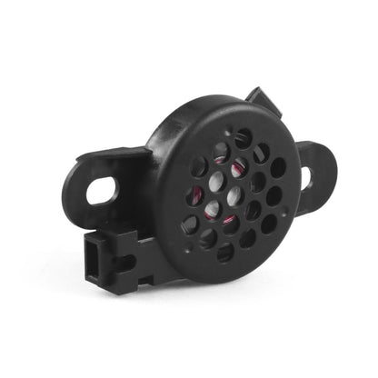 Black car reversing radar horn with circular speaker grille and mounting tabs