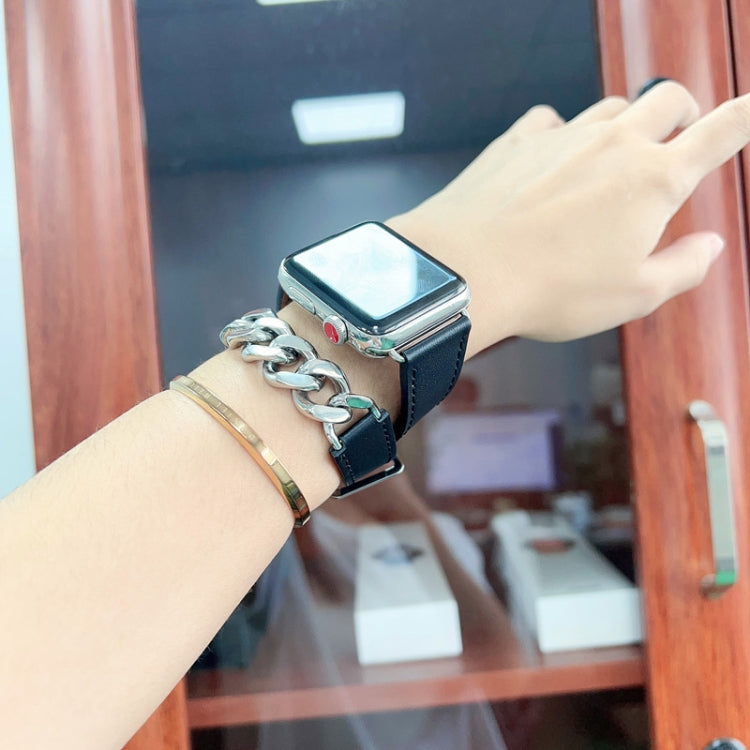 Genuine leather watch band with stainless steel double links on a wrist.
