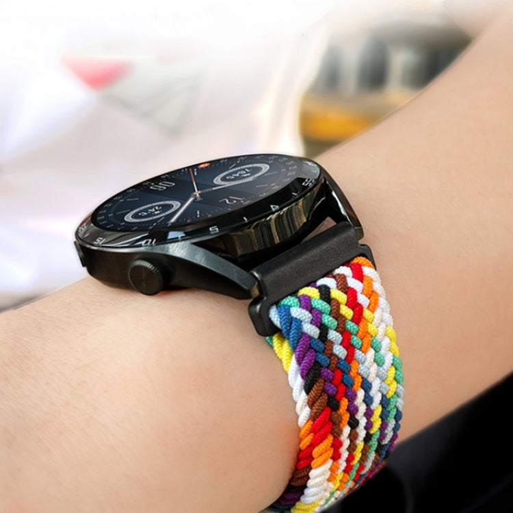 Rainbow braided nylon watch band with metal buckle clasp on wrist