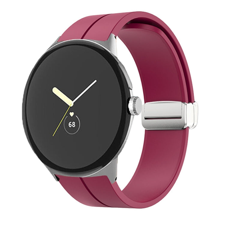 Pink silicone watch band with folding buckle and silver clasp, shown on watch.