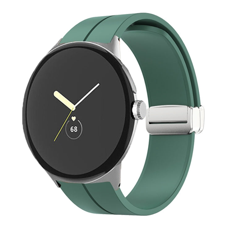 Green silicone watch band with folding buckle and silver clasp, shown on watch.