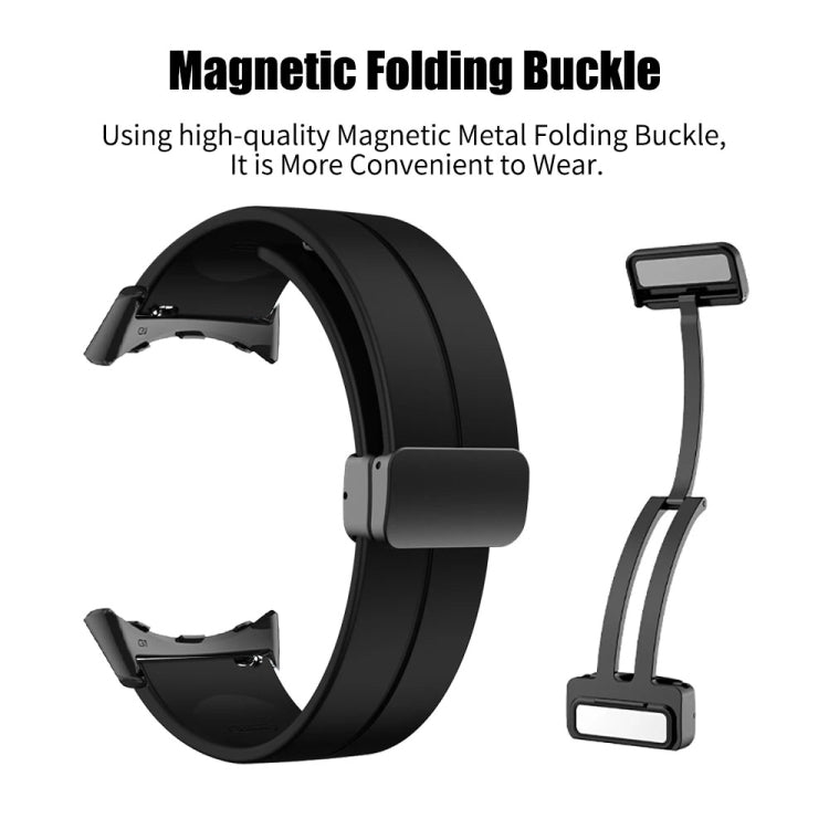 Black silicone watch band with magnetic folding buckle, close-up with clasp parts.