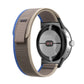 Loop nylon watch band with connector, beige band with blue edge stripe.