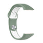 Two-color silicone watch band with reverse buckle, green and white perforated strap detail