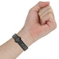 Two-color silicone watch band with reverse buckle on wrist, black strap with perforated light underside