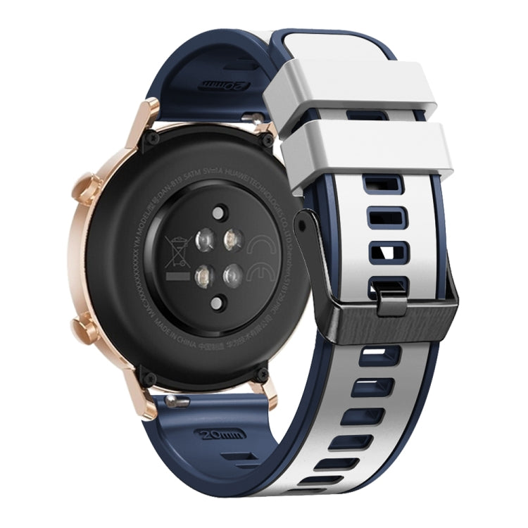 Two-tone silicone watch band in dark blue with white clasp and adjustable holes.