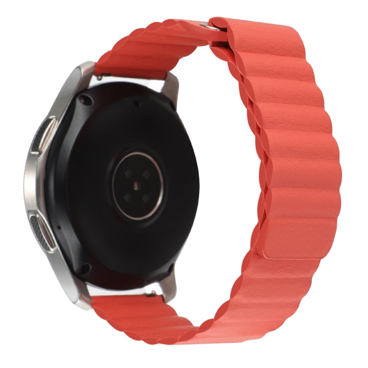 Orange magnetic loop watch band shown from the back with smartwatch body