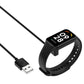 USB charging cable magnetically attached to black smartwatch band