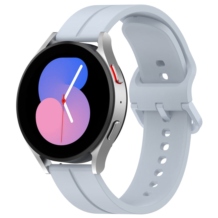 Silicone watch with groove band in light blue, black round dial with colorful hands