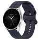 Navy silicone watch band with clasp, rear holes visible along the strap.
