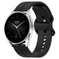 Black silicone watch band with clasp and strap adjustment holes, rear view angle.