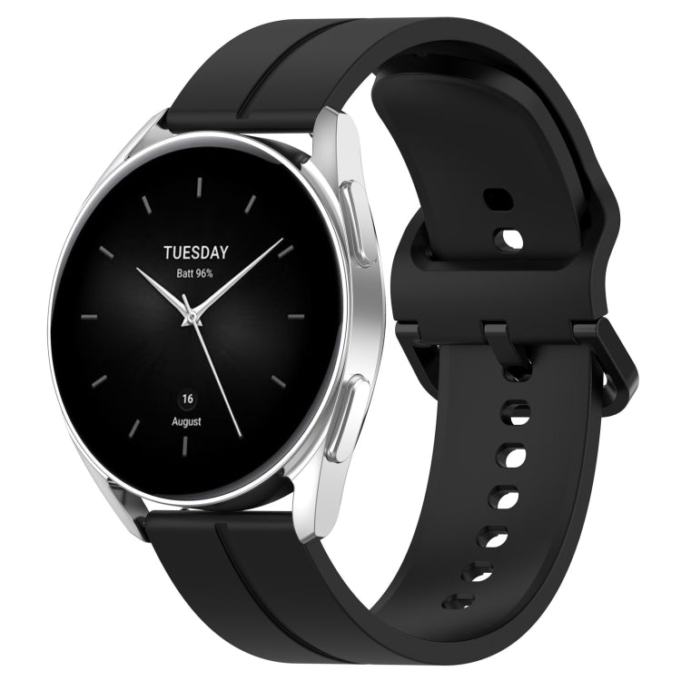 Black silicone watch band with clasp and strap adjustment holes, rear view angle.