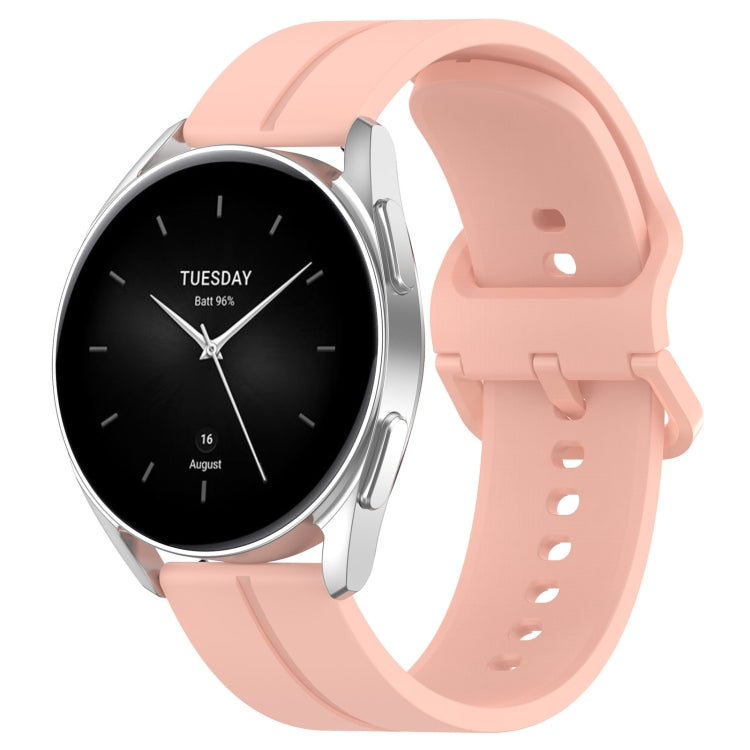 Silicone watch with groove band in light pink, black dial with day text and hands