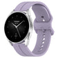 Silicone watch with groove band in light purple, black dial with day text and hands