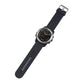 Black silicone watch strap with metal buckle and mounted on a round smartwatch