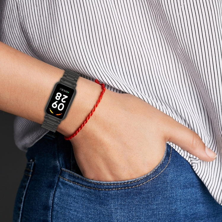 Three-bead steel watch band worn on wrist, black link strap with fitness watch screen
