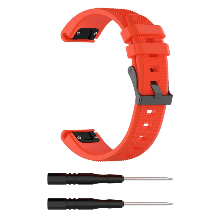 Orange silicone replacement watch strap with quick-release buckle and pin tools