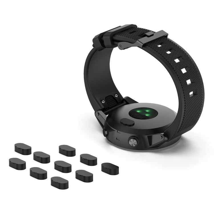 Black watch charging port dust plugs, 10-piece set shown next to smartwatch