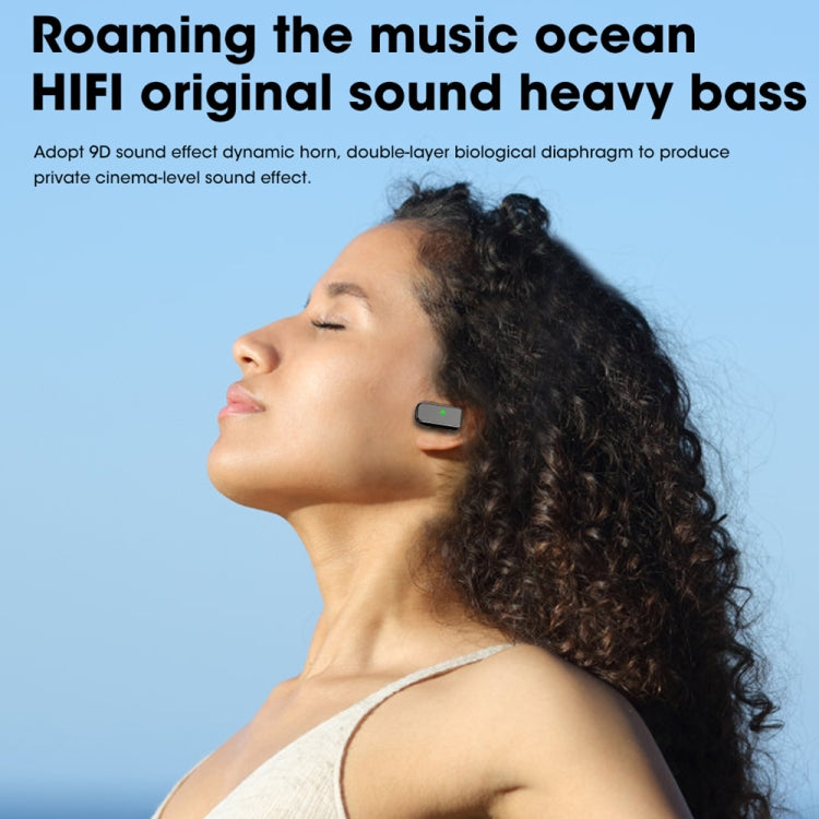 Black wireless earbuds worn in-ear on a person’s ear.