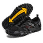Men's outdoor hiking shoes, black/gray knit upper with yellow triangular accent and tread sole