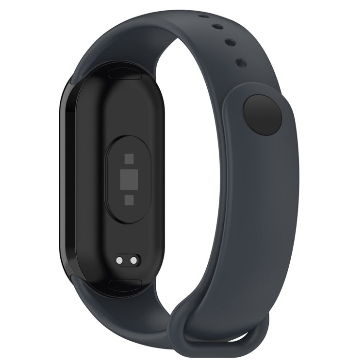 Black smartwatch strap front view with oval side button and charging contacts