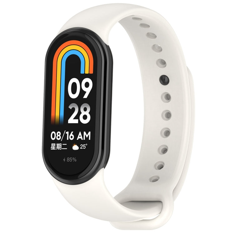 White silicone smartwatch band with oval tracker body, perforated holes, Mi Band 8