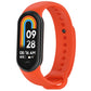 Orange silicone smartwatch band with oval tracker body, perforated holes