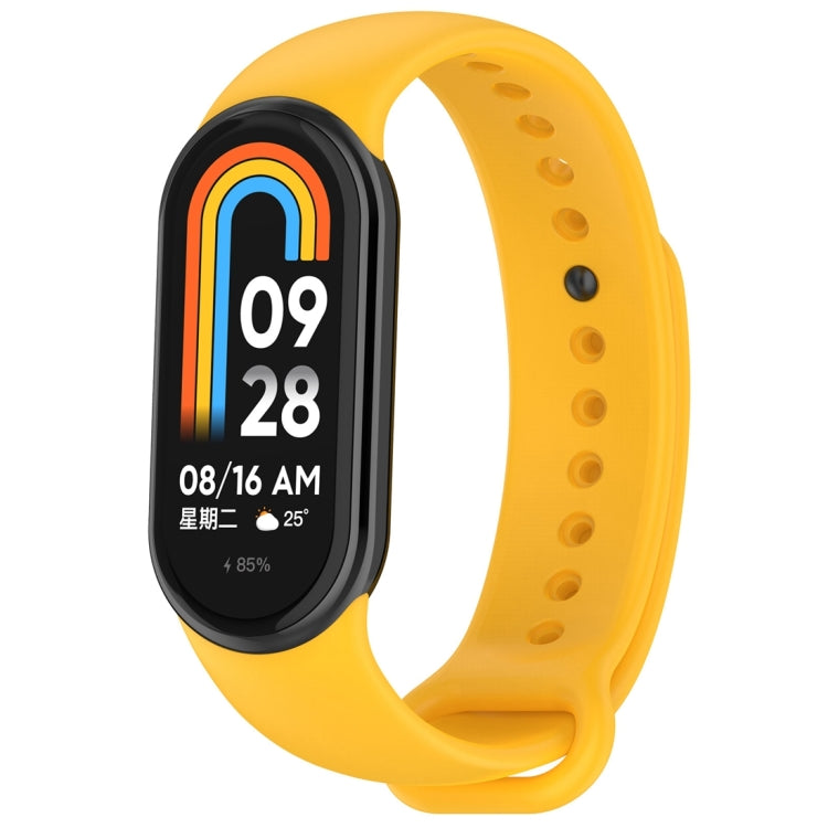Yellow silicone smartwatch band with oval tracker body, perforated holes