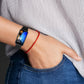 Black Milanese metal watch band on wrist with mesh strap and clasp