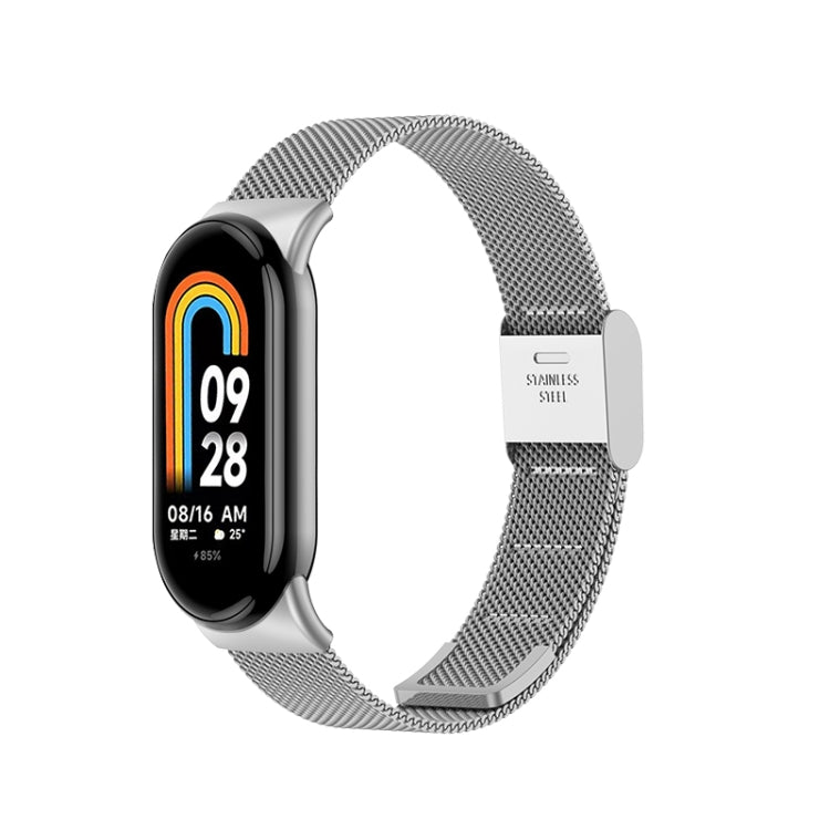 Stainless steel Milanese metal watch band with clasp, shown with black fitness watch