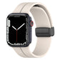 Two-color silicone watch band with folding buckle, light beige and black.