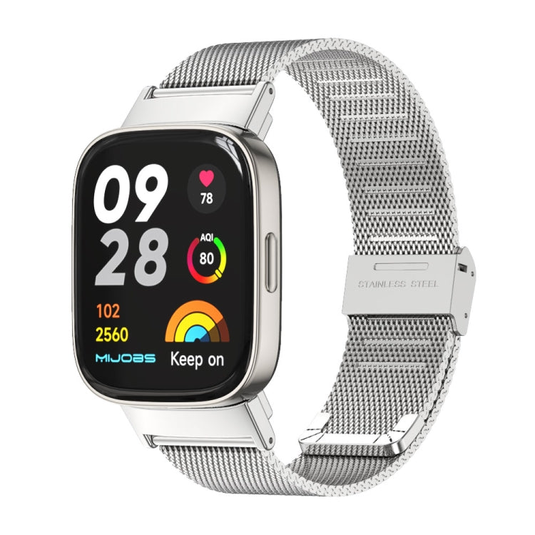 Gray stainless-steel mesh watch band with metal buckle for a smartwatch.