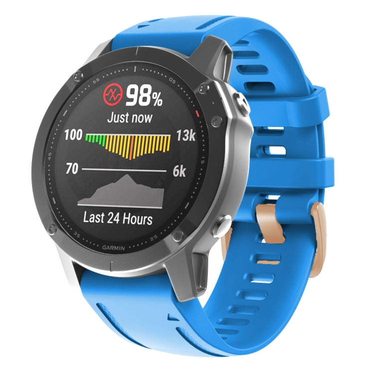 Blue silicone watch band with rose-gold buckle and adjustable holes