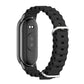 Black breathable silicone watch band with metal clasp, shown with smartwatch side attached