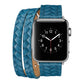 Blue braided leather watch band with embossed crown detail and silver buckle