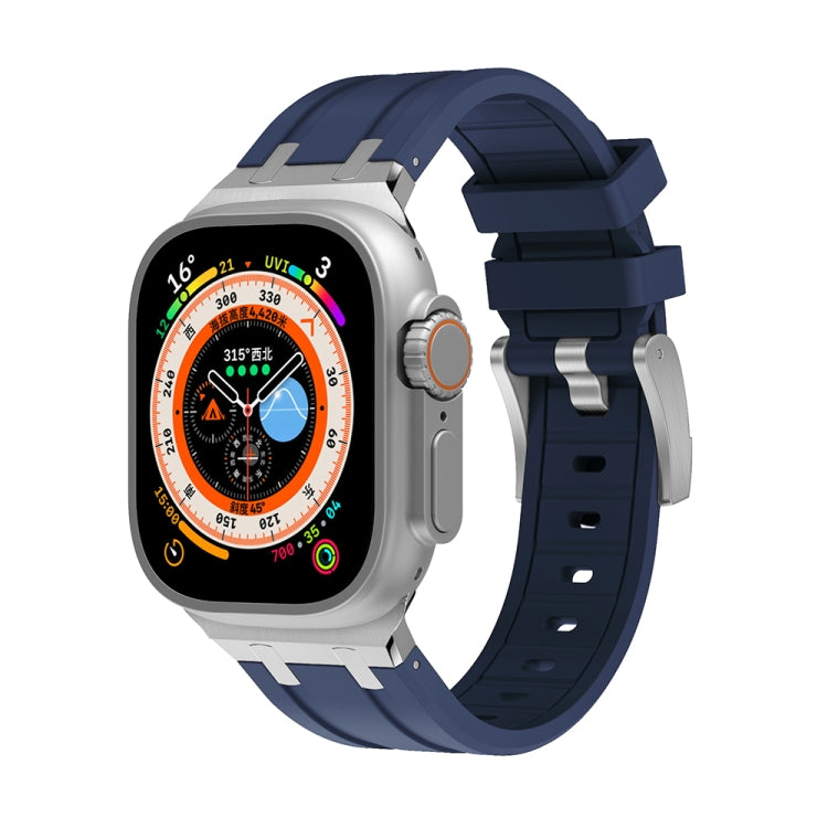 Blue silicone Apple Watch band with silver-tone clasp and multiple adjustment holes
