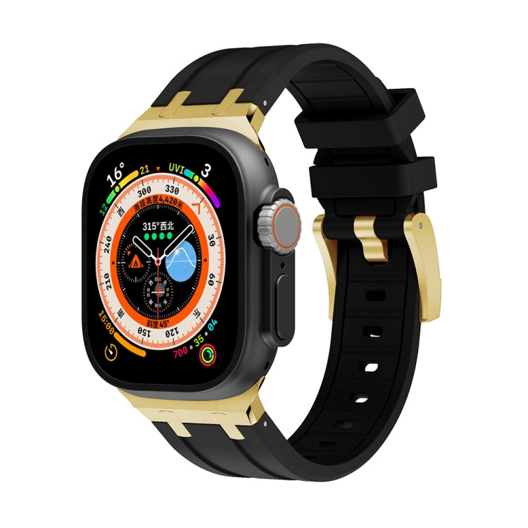 Silicone watch band with black strap and gold-tone buckle and link accents for Apple Watch