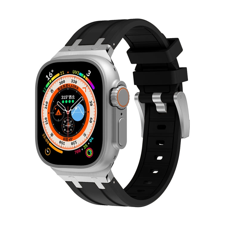 Black silicone watch band with silver metal clasp and adjustable strap holes