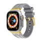 Silicone watch band with dark gray strap and gold links for Apple Watch
