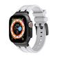 White silicone Apple Watch band with black-toned clasp and vent holes