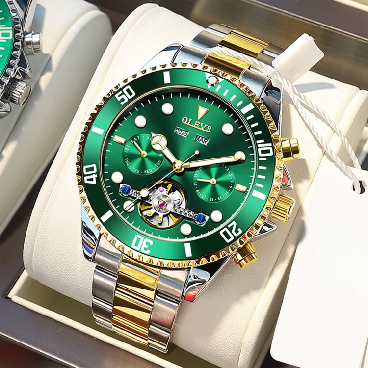 Green dial multifunction mechanical watch on white cushion with gold and steel bracelet