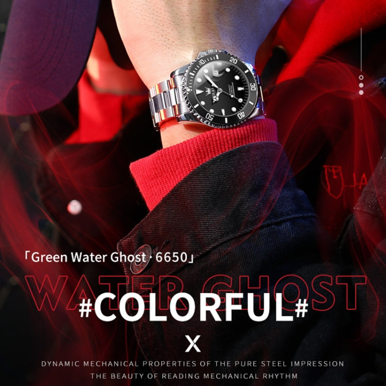 Mechanical waterproof wristwatch on wrist with black dial, luminous indices, stainless steel bracelet