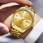 Gold-tone quartz watch close-up on wrist with diamond hour markers and date window