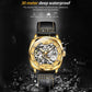 Men's gold hollow mechanical watch with black leather strap in splashing water