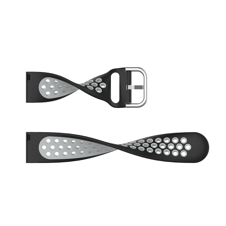 Black silicone sports watch strap with perforated holes and silver metal buckle hardware