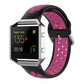Fitbit silicone watch strap with black base and magenta accents, perforated sporty design