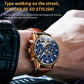 Mechanical watch on wrist with blue skeleton dial, brown leather strap, rose-gold case