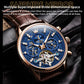 Close-up mechanical watch face with blue skeleton dial, rose-gold case, brown leather strap