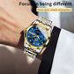 Two-tone men’s quartz watch with blue dial, gold bezel, and stainless bracelet on wrist