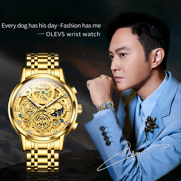Gold-tone OLEVS multifunction skeleton watch worn on wrist with metal link bracelet